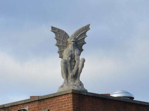 A statue on top of a building in Culpeper, Virginia. At least, I hope it was a statue.