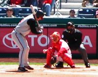 Batter at the Plate, with Toyota ad on the wall behind batter and catcher