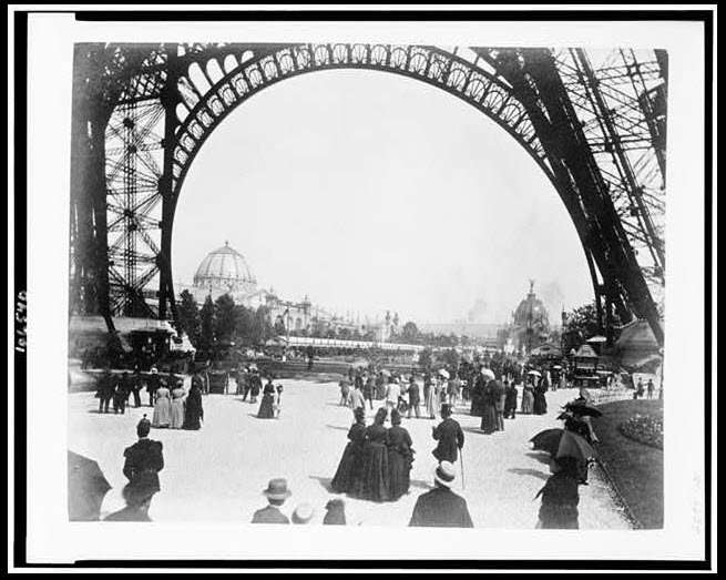 Looking through the base of the Eiffel Tower.