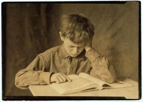 An image of a boy reading